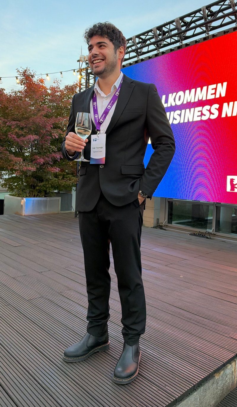 Çağrı Tulumoğlu in a dark suit at an evening business event in Berlin